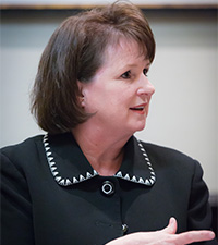 Portrait of Laurie Brignac, Managing Director, Head of Global Liquidity Portfolio Management, Invesco