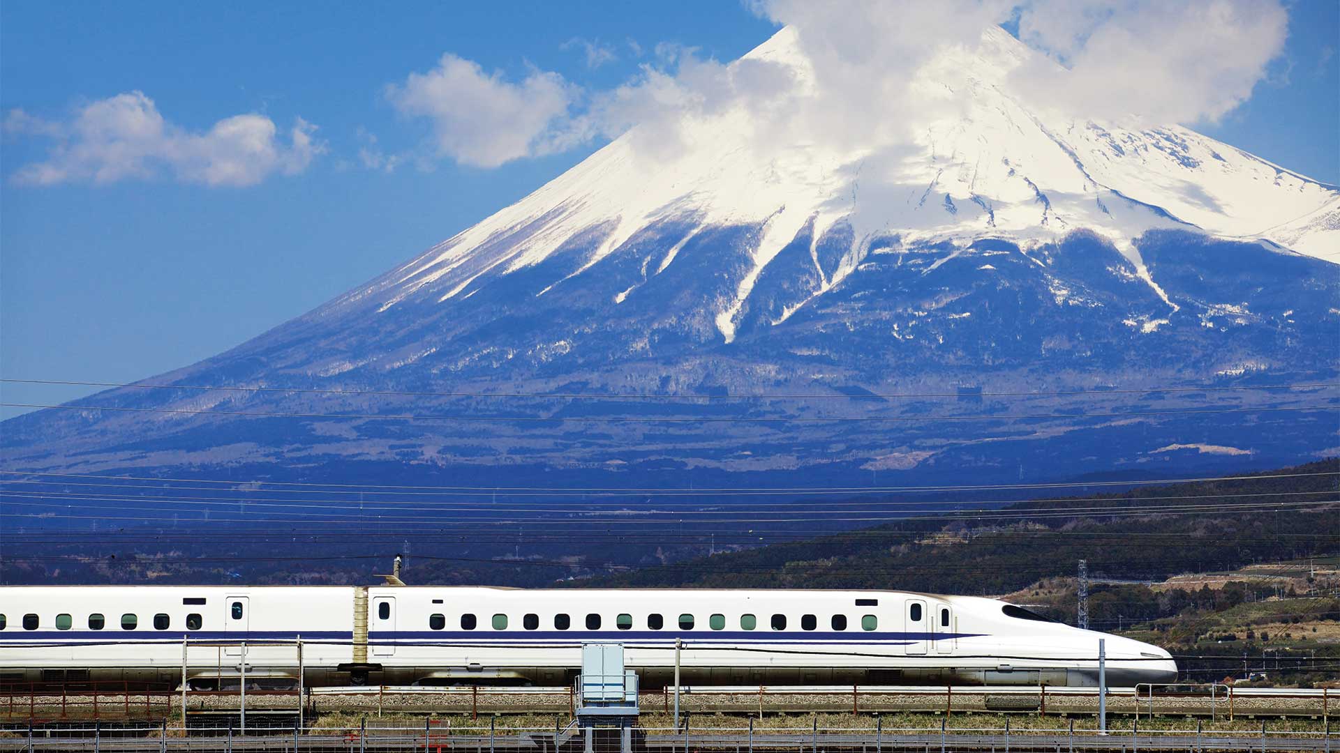 View of Mount Fuji with train in the foreground