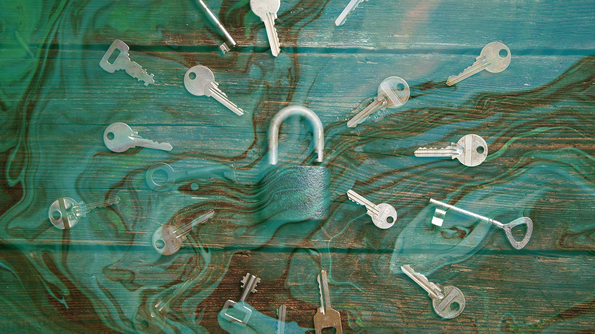 Keys surrounding lock with liquid overlaid