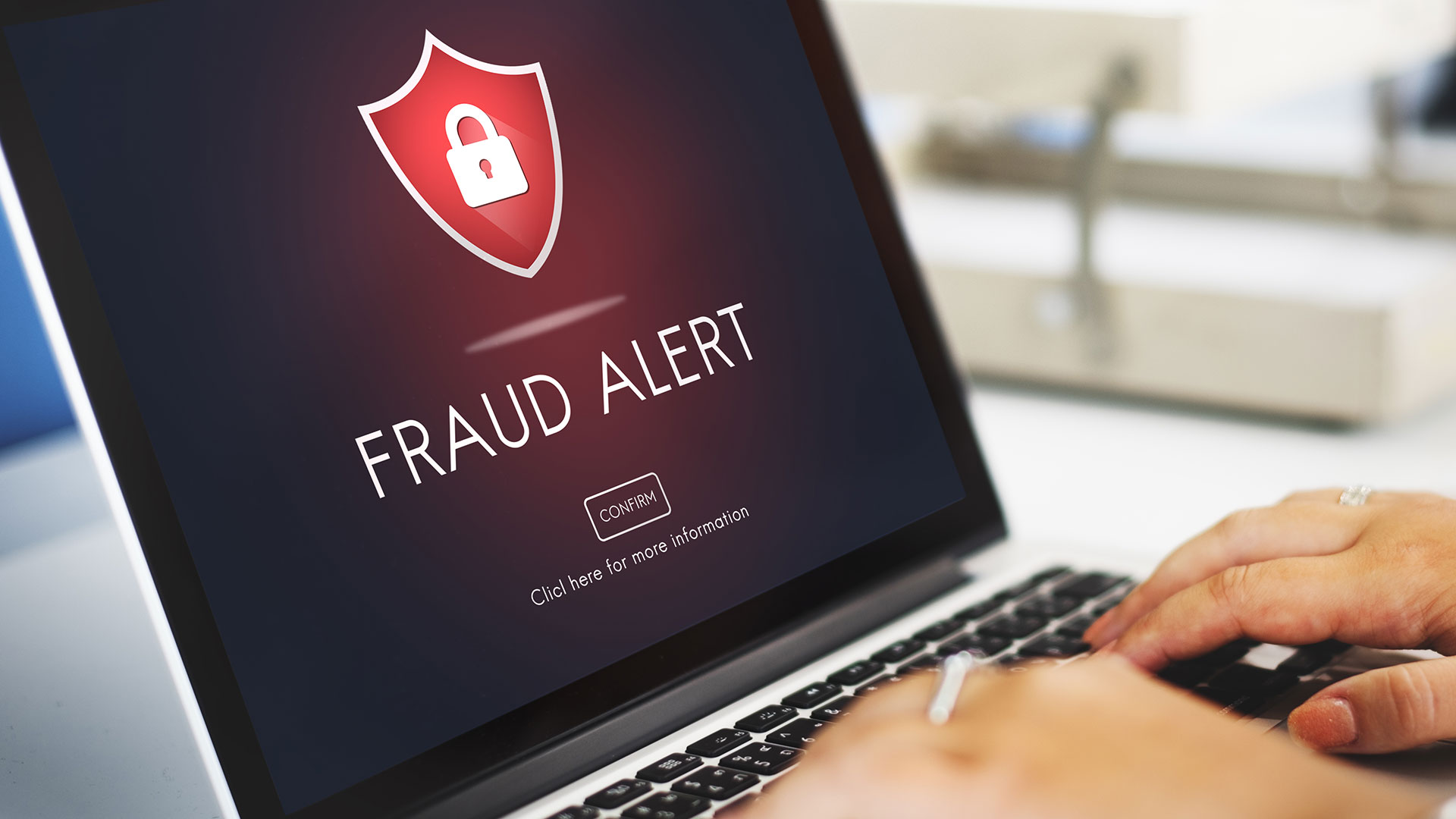 Scam fraud alert message on laptop