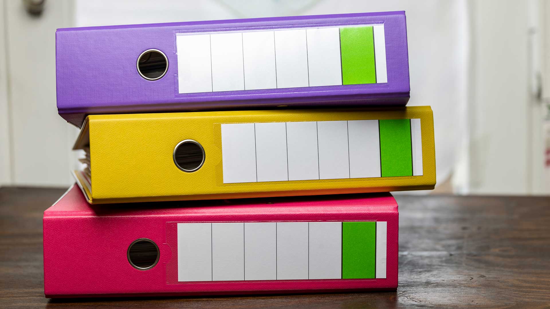 Colourful folders on a desk in a study