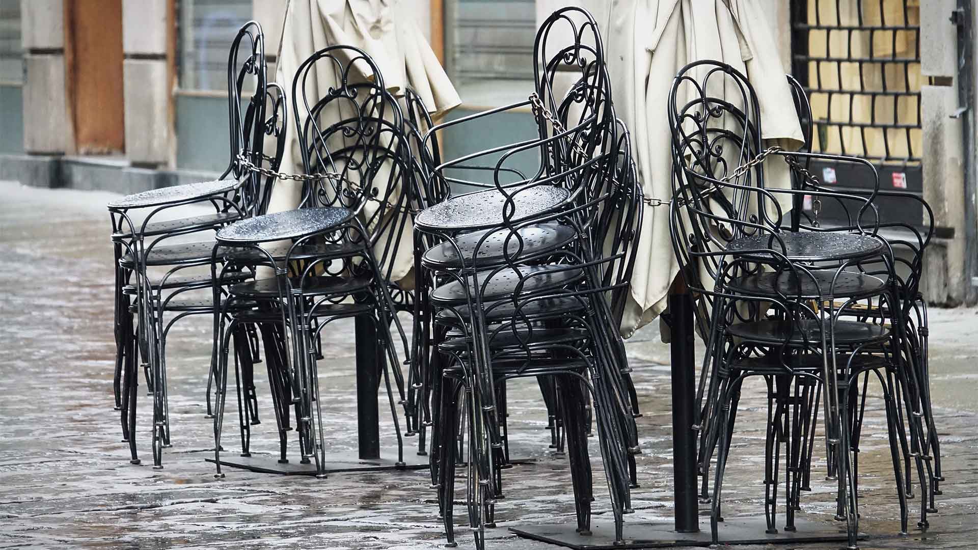 Stacked chairs, empty cafe
