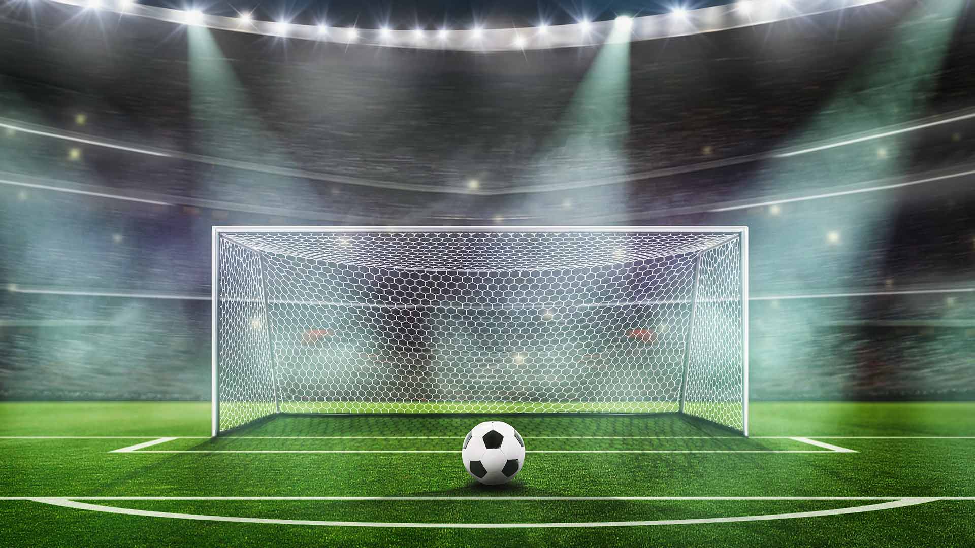 A football ready to be kicked into a net