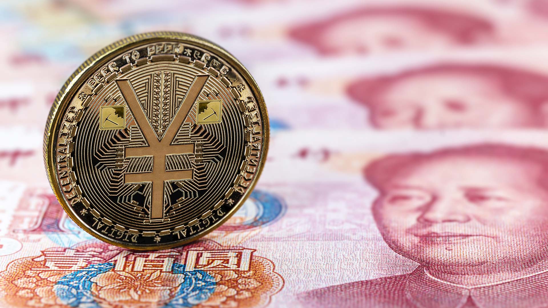 Digital Yuan coin on Yuan notes