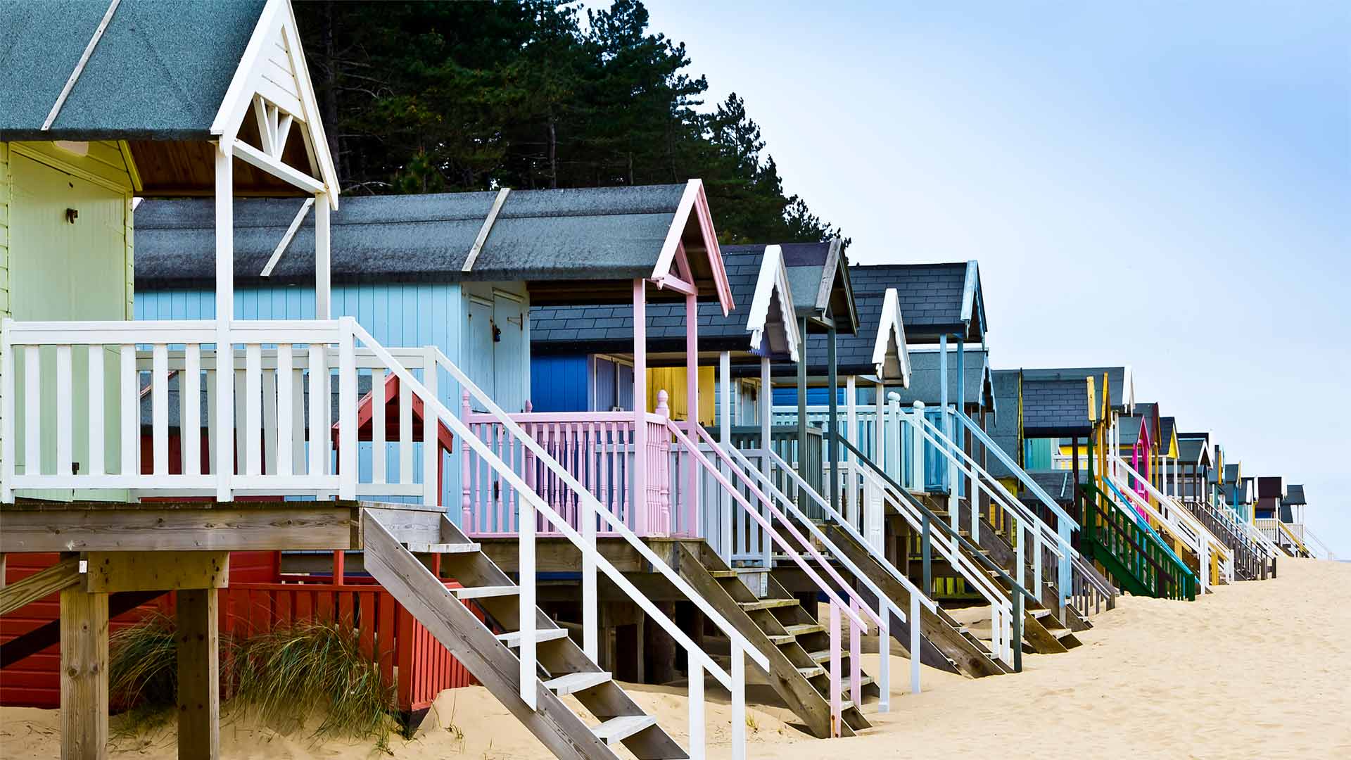 Colourful beachhuts on stilts