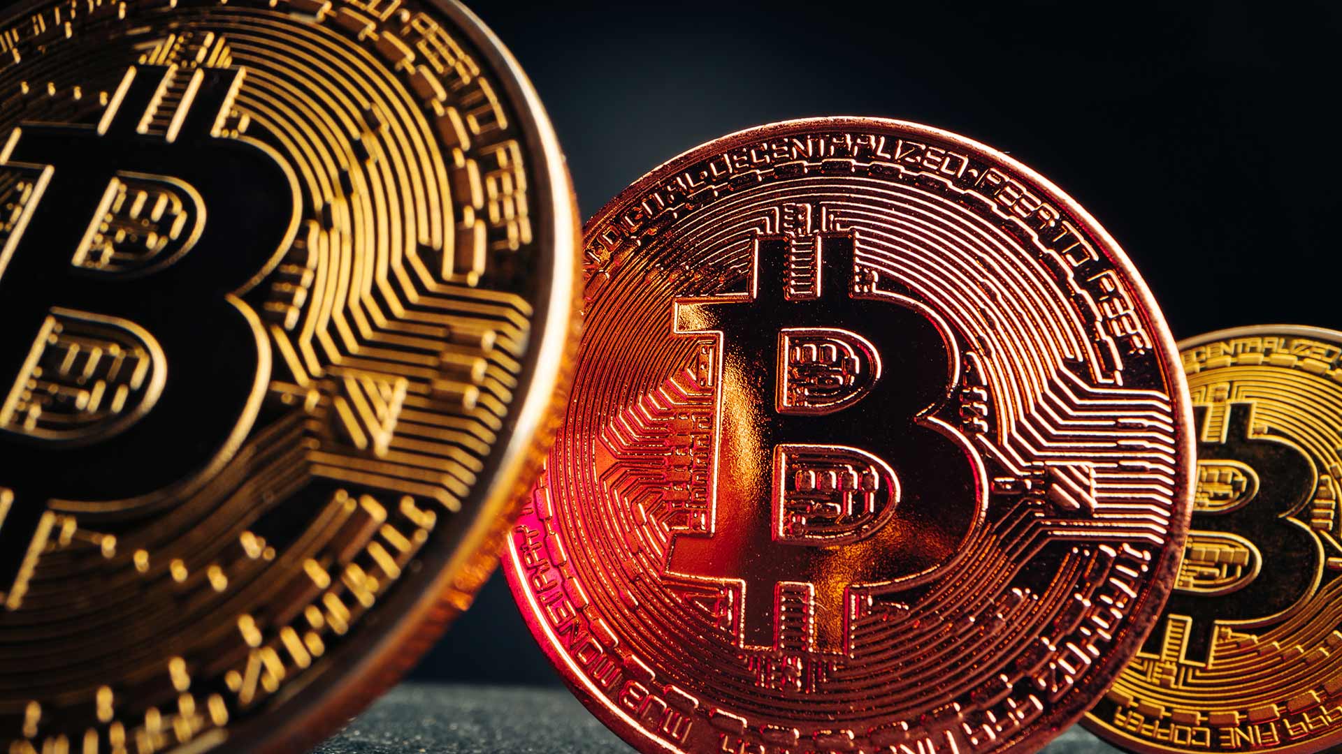 Close up of three bitcoins