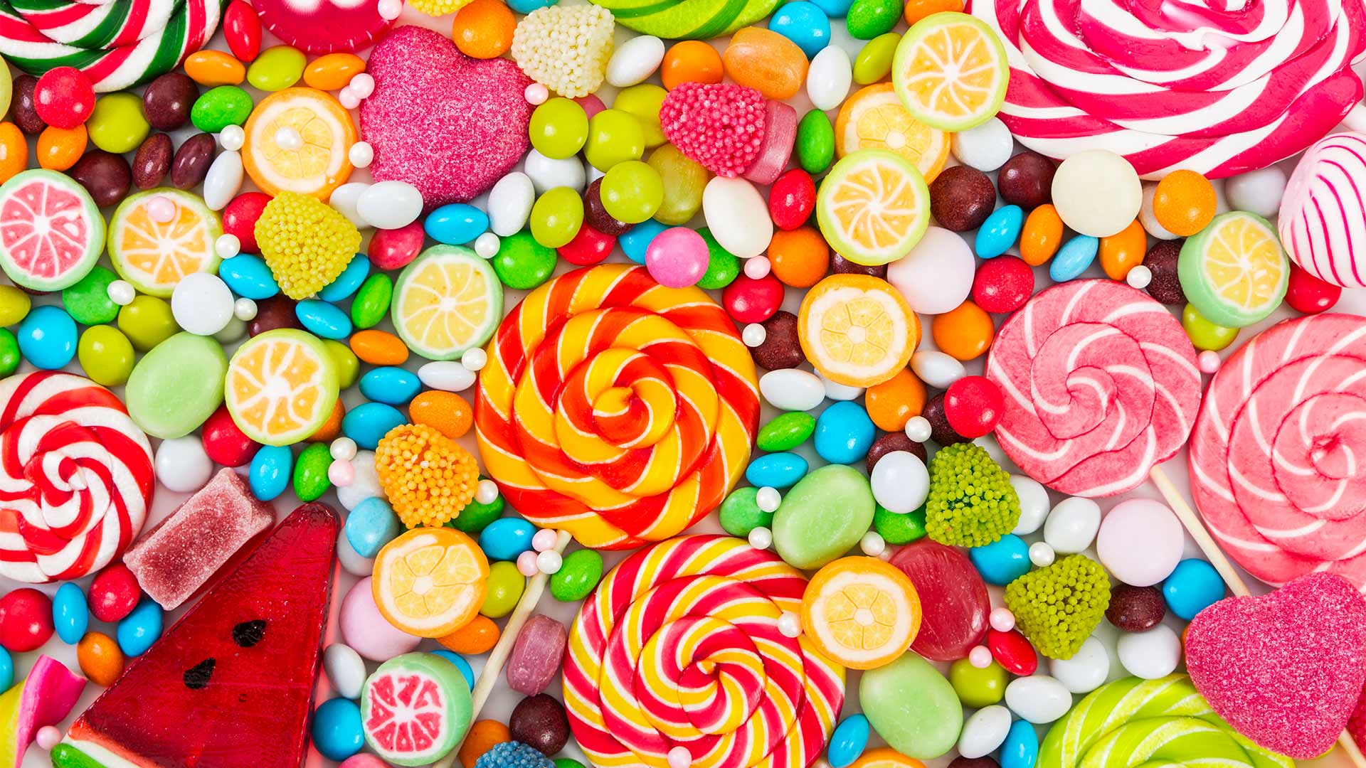 Bunch of sweets laid on table