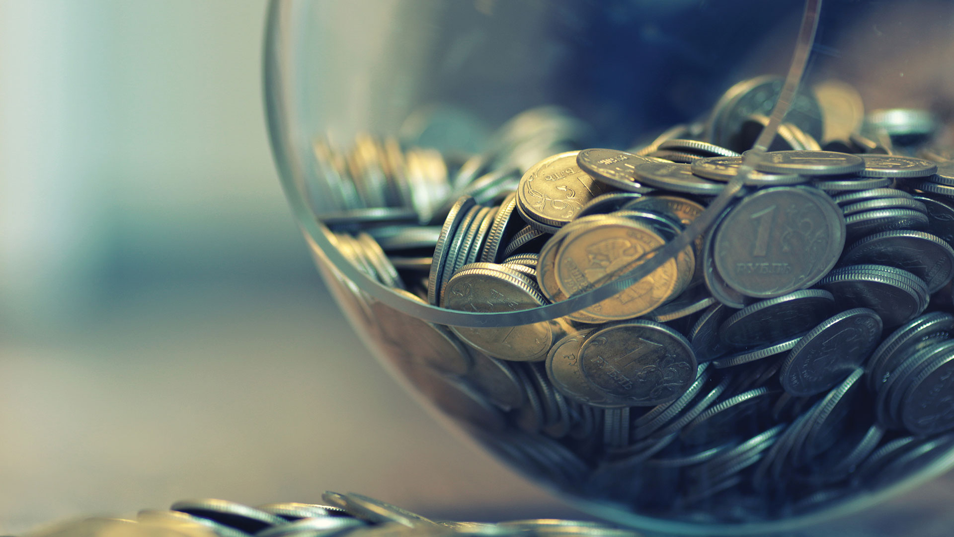 Coins in piggy bank vase