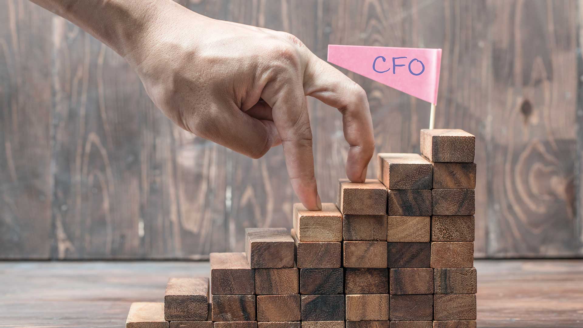 Person using fingers as a symbol of someone walking up steps to become CFO