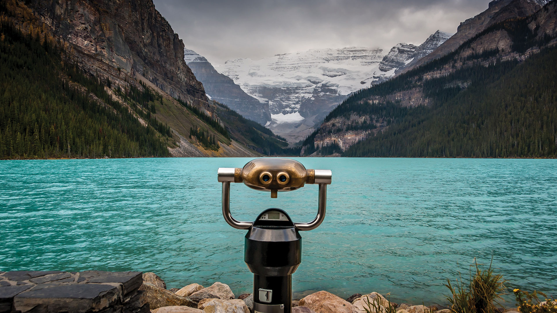 Coin operated binoculars facing lake