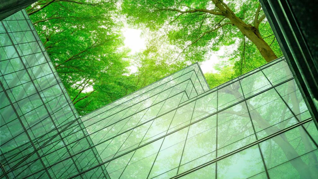 Glass corporate building surrounded by trees