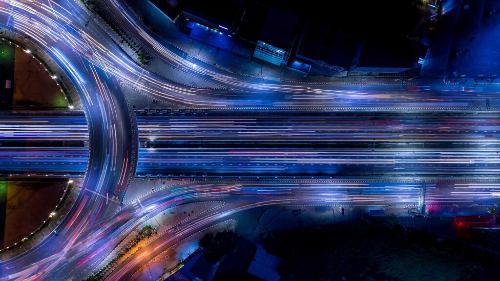 Busy roads during the night with light trails