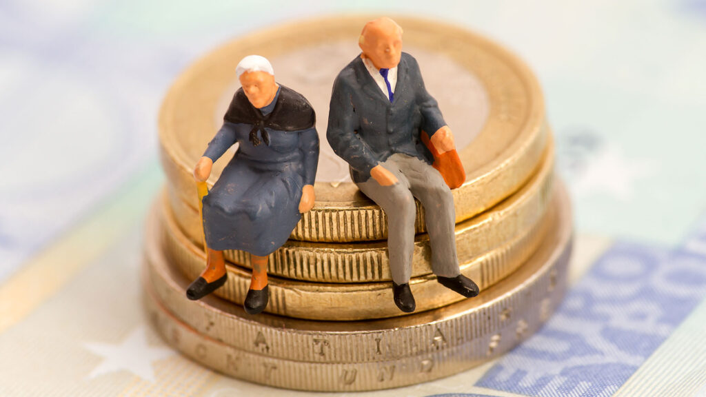 Pension aged people sitting on money