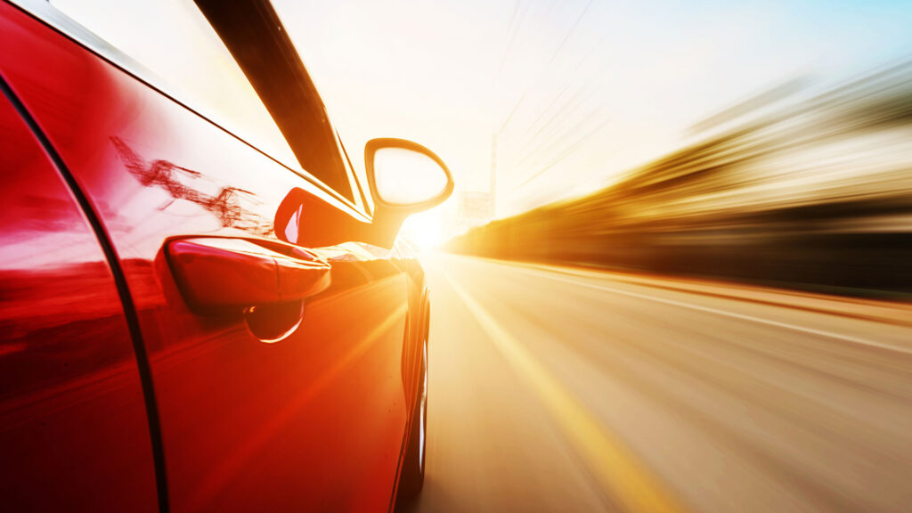 Red car speeding down the motorway