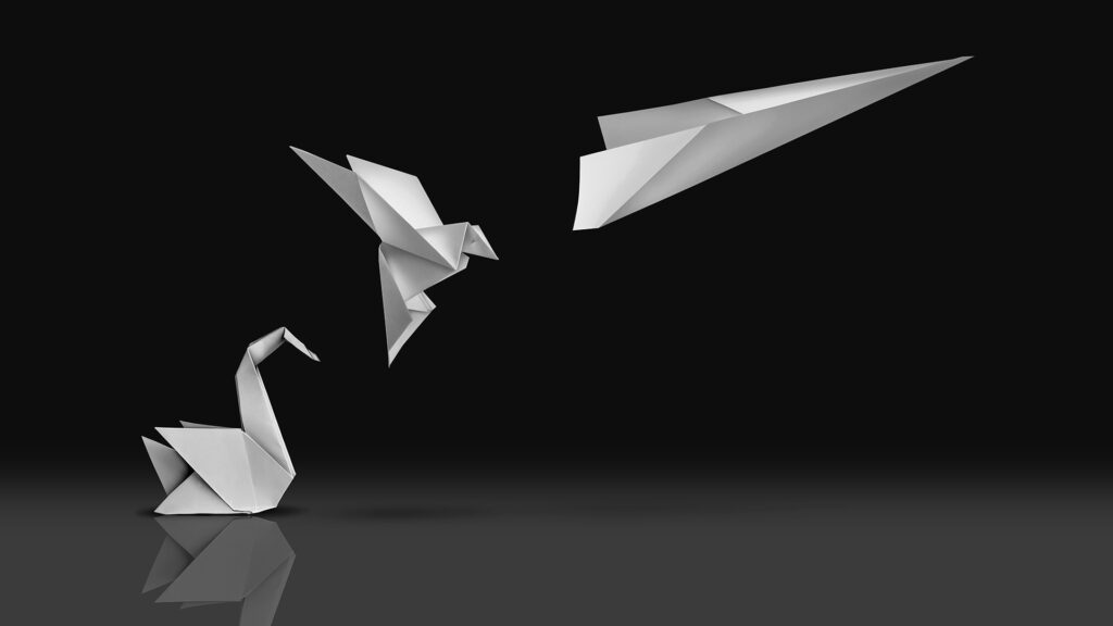 Origami birds transforming into a paper plane