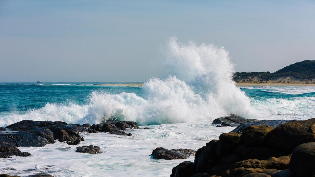 Ocean waves crashing against rocks