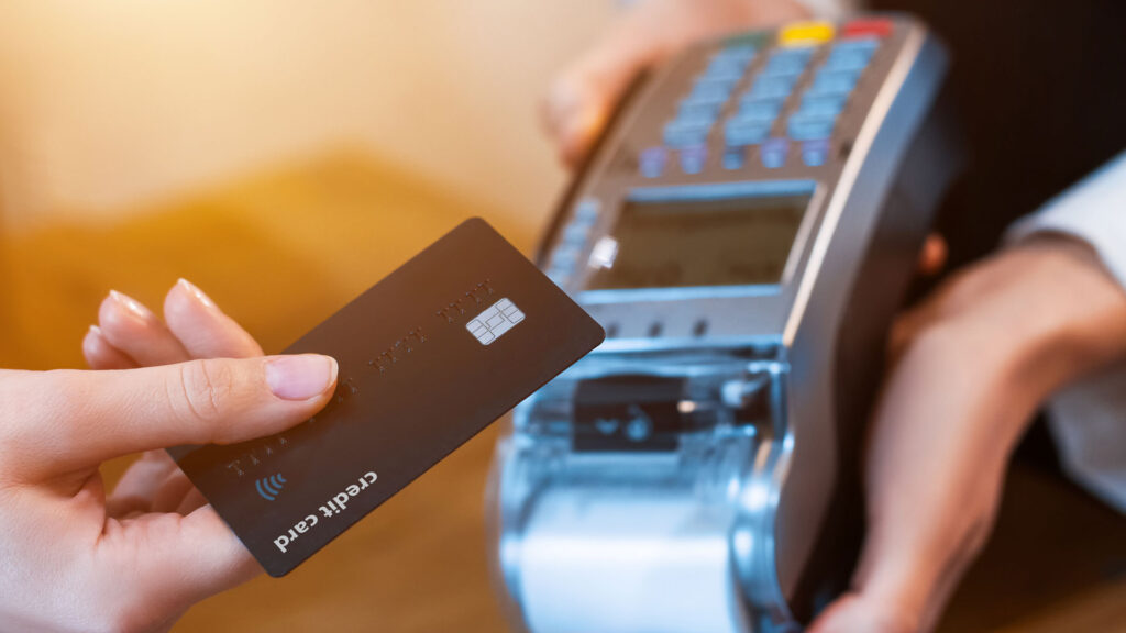 Person using contactless card when paying