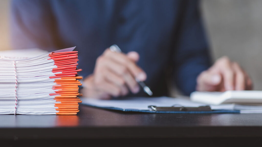 Auditor working through papers