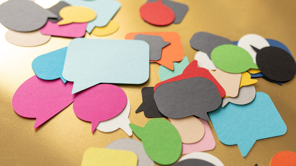 Communication concept with paper speech bubbles