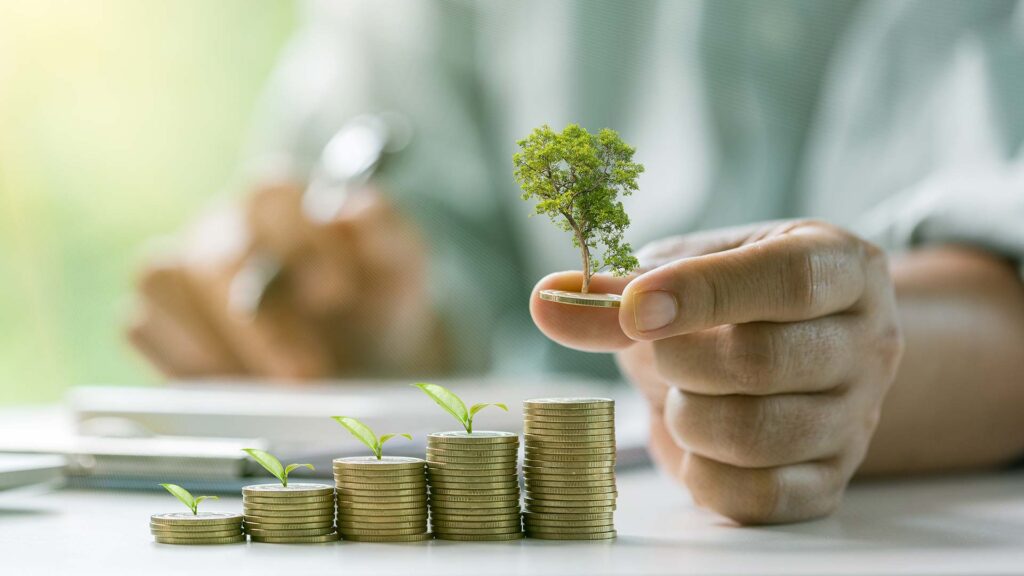 Increasing stacks of coins with trees growing on them