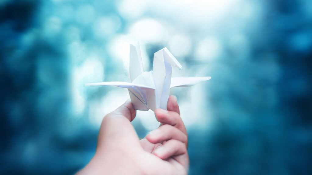 Person holding origami bird