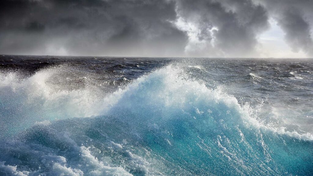 Rough sea with big waves and a dark sky