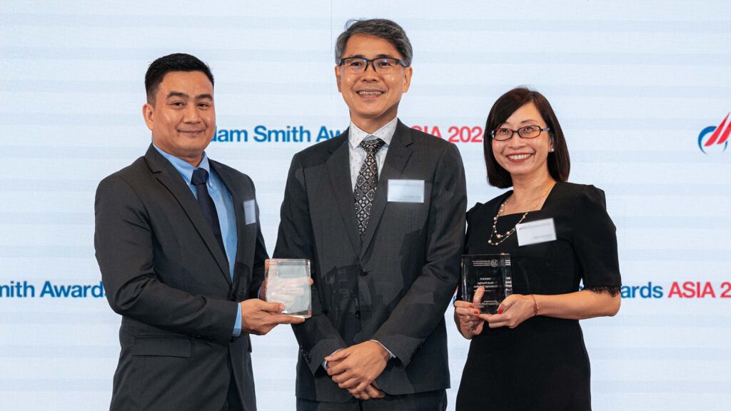 Photo of Eric Tuliao and Kian Hwee Ong, International Baccalaureate Organisation and Mei Lian Geow, J.P. Morgan.