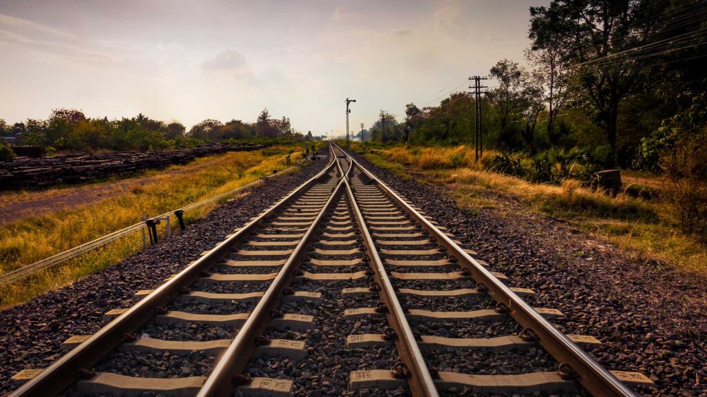 Two railway tracks merging into one rail