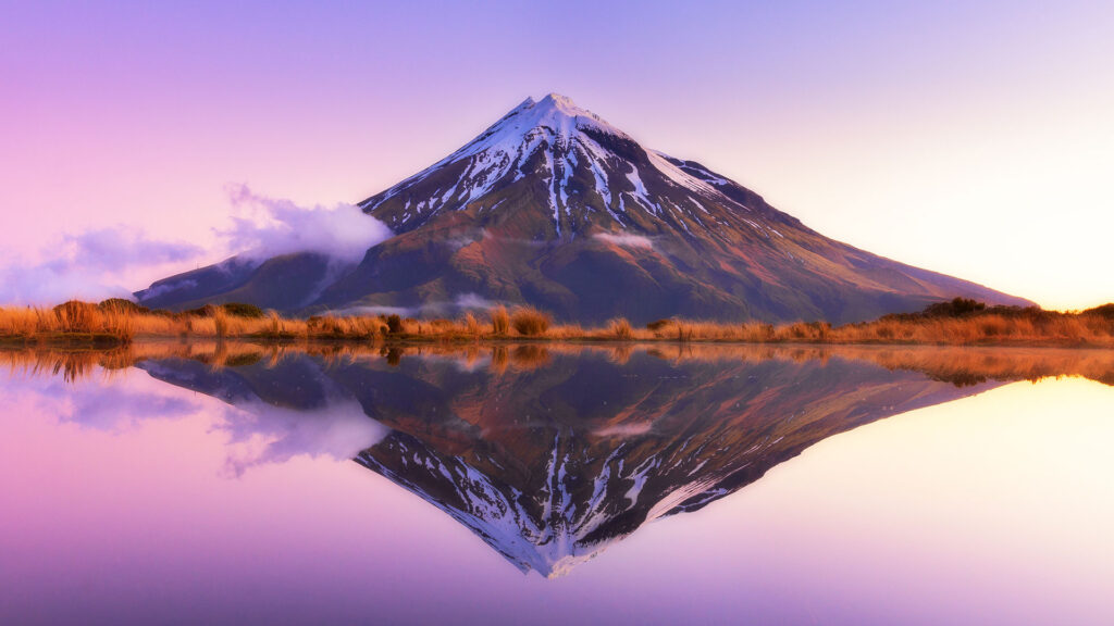 Mount Taranaki at dusk, with reflection in the water