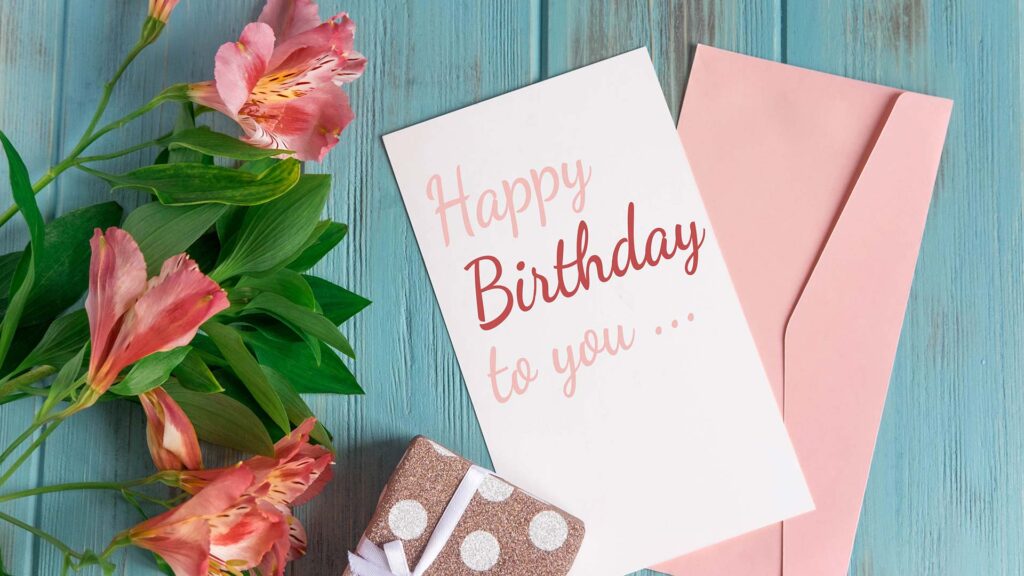 Birthday card with present and flowers