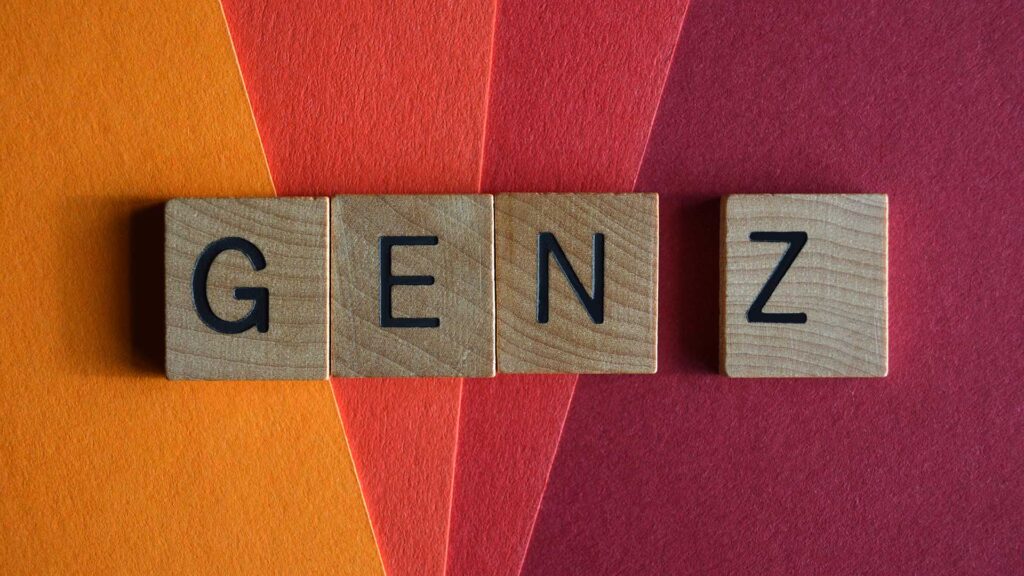 Wooden cubes spelling out Gen Z with a colourful background