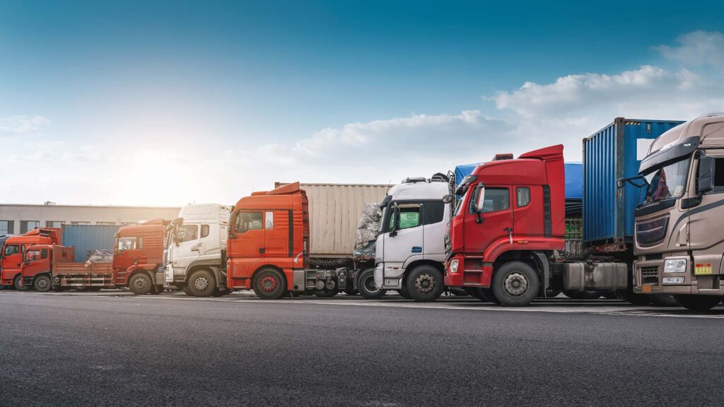 Row of delivery trucks ready to move cargo