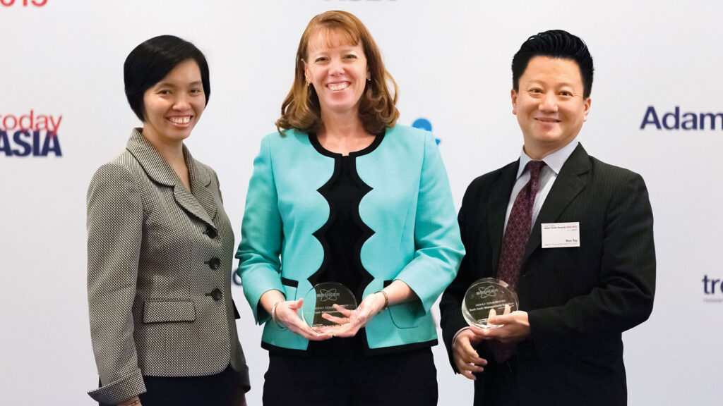Photo of Rosa Tan and Stacey Desrochers, Bruker Corporation and Don Tay, Bank of America Merrill Lynch.