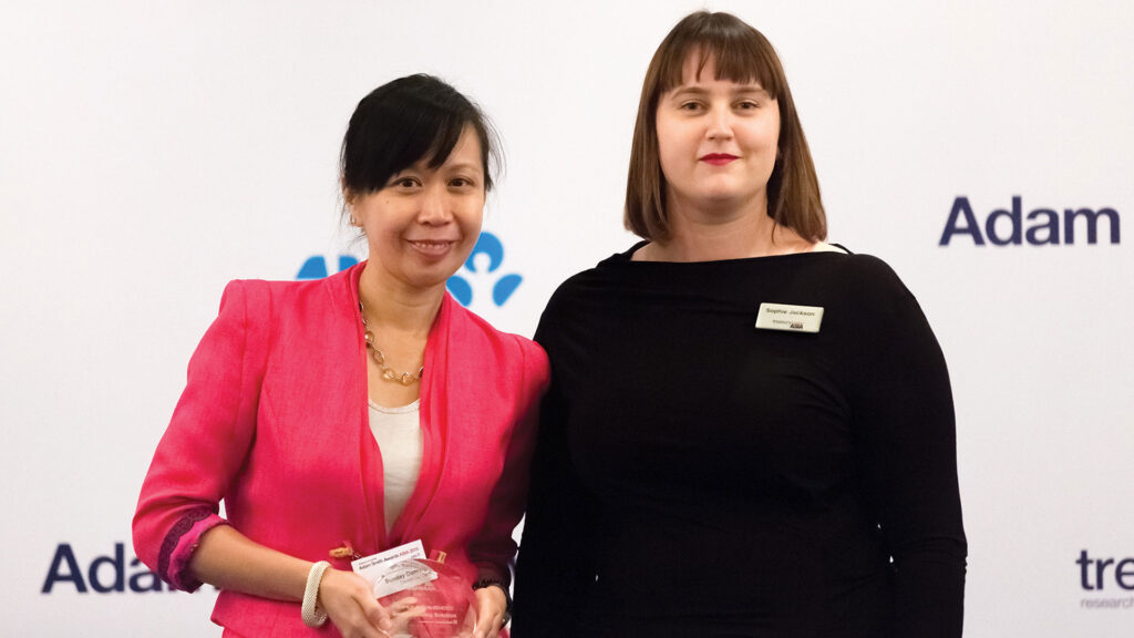 Photo of Sunday Domingo of Deutsche Bank collecting the award on behalf of The Sanmar Group.