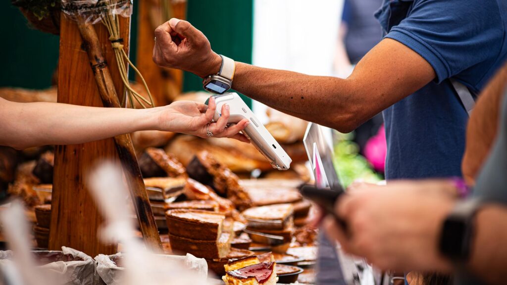 Person making contactless payment with their smartwatch