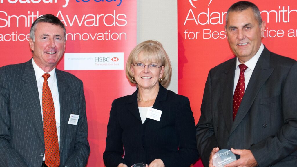 Photo of Richard Parkinson, Carole Berndt, Bank of America Merrill Lynch and Steve Donovan from ConocoPhillips accepting on behalf of Judy Bouchard.