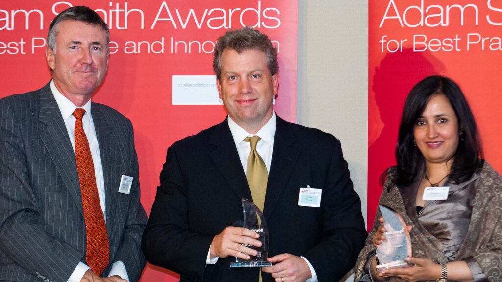 Photo of Richard Parkinson, Jim Colby from Honeywell accepting on behalf of Michael Suriano and Swati Mitra, Citi.