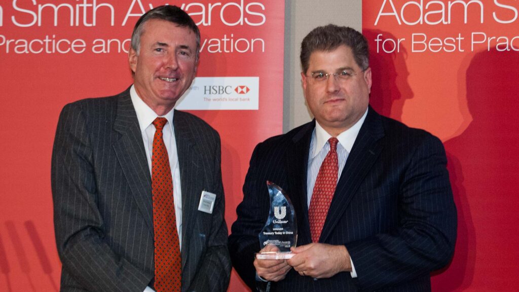 Photo of Richard Parkinson and Michael Guralnick, Citi accepting on behalf of Fred Tang.