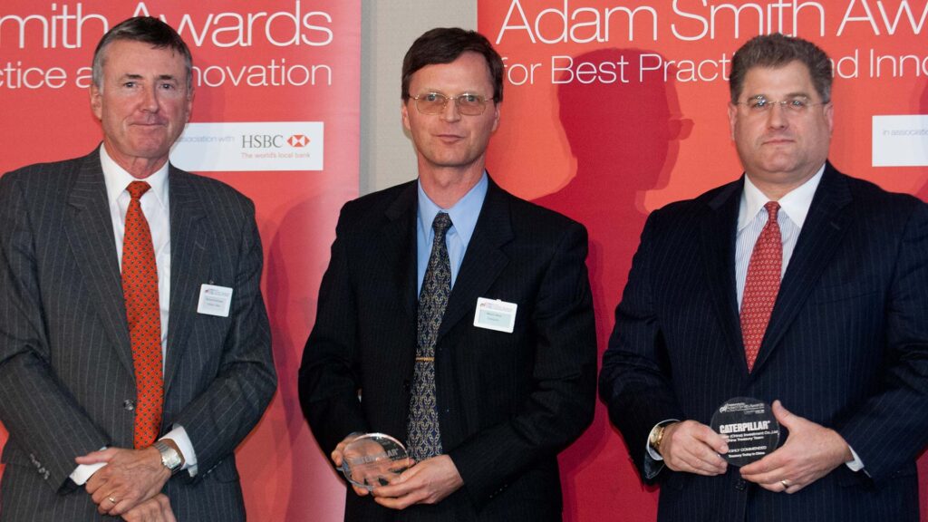 Photo of Richard Parkinson, Martin Bina from Caterpillar and Michael Guralnick of Citi accepting on behalf of Fiona Yang.