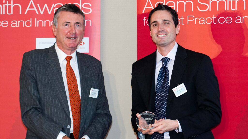 Photo of Richard Parkinson and Mike Scalora from Google accepting on behalf of Vincent Doromal.