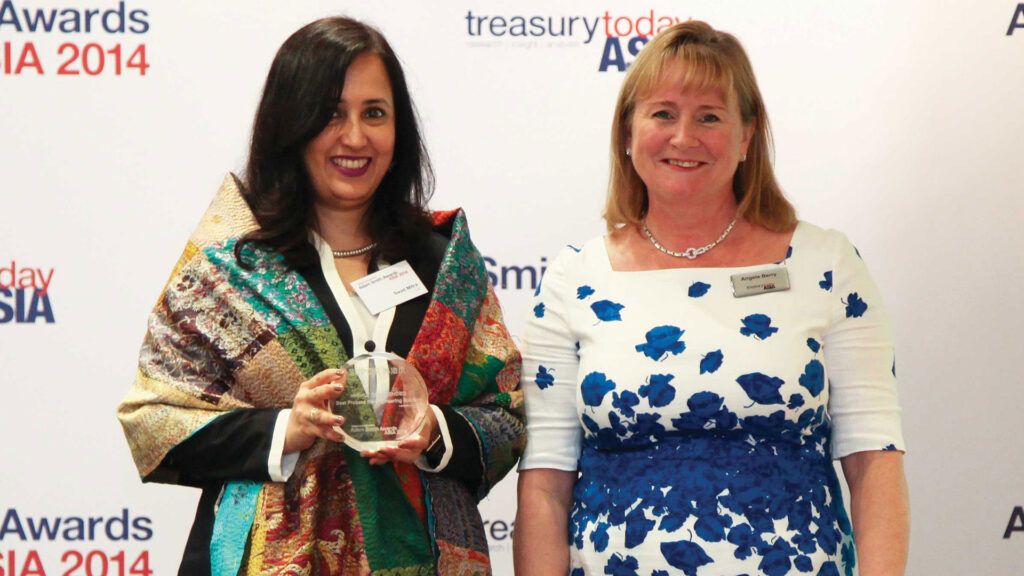 Photo of Swati Mitra of Citi collecting the award on behalf of Zhejiang Supor.
