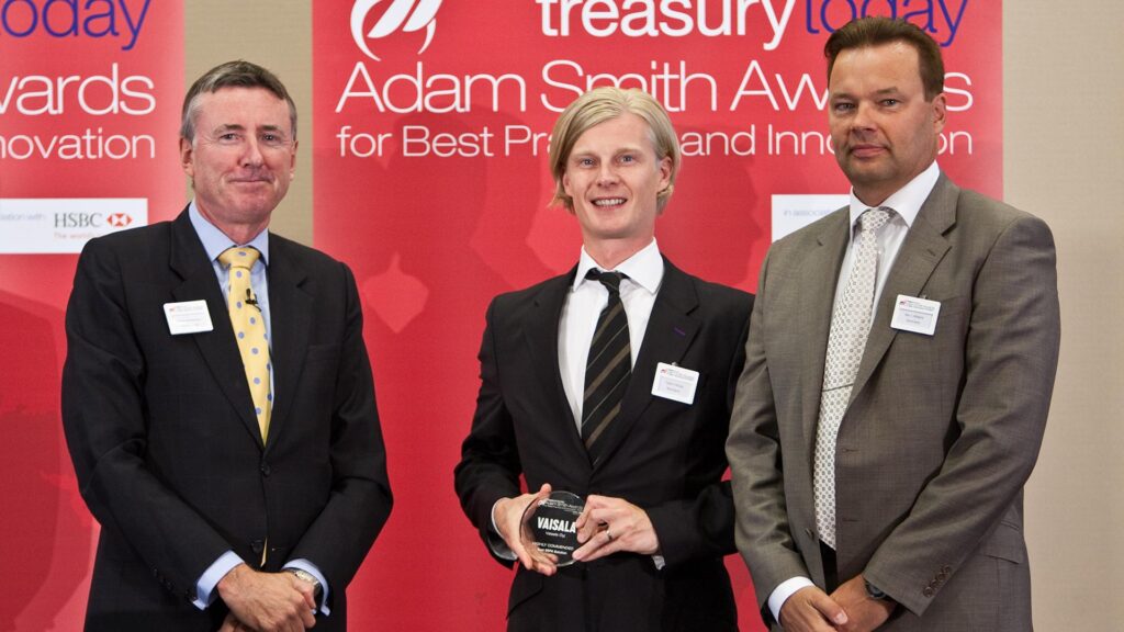 Photo of Richard Parkinson, Tapani Oksala and Kari J. Mäkelä, OpusCapita accepting on behalf of Vaisala Oyj.