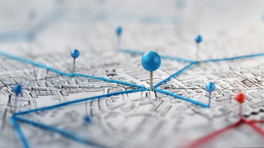 Map with location pins and strings attached