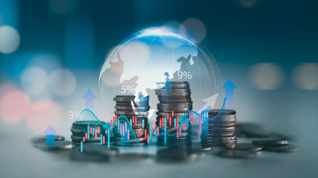 Stacked coins with digital globe and charts