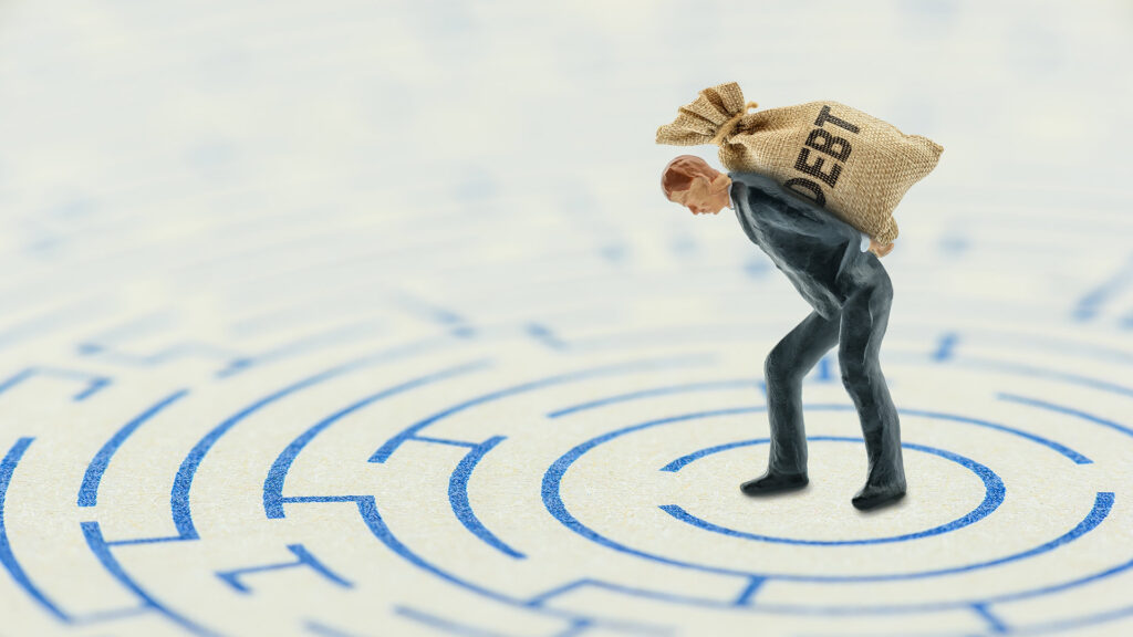 Figure holding debt in maze.