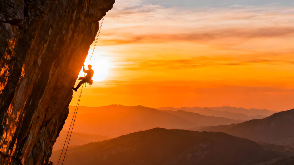 Person doing extreme rock climbing.
