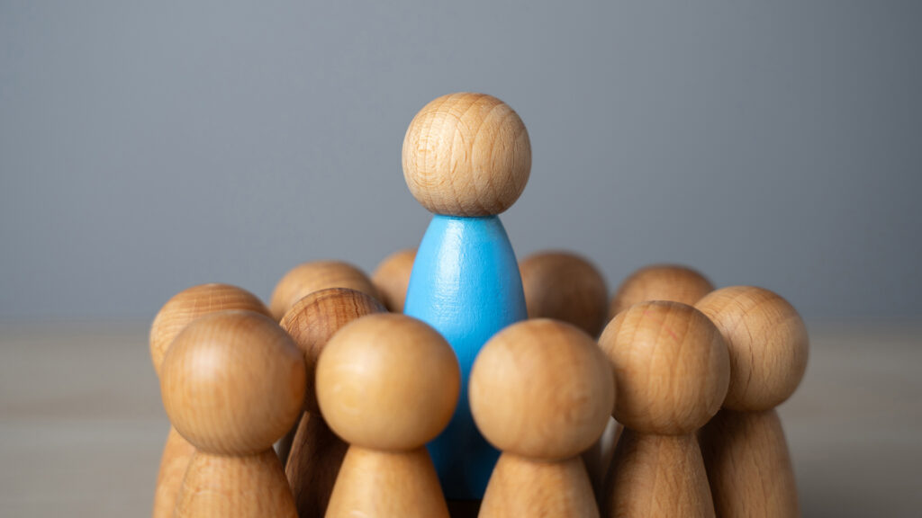 Leader concept, toy wooden pieces.